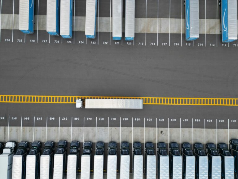 Aerial view of a logistics depot with parked freight trucks